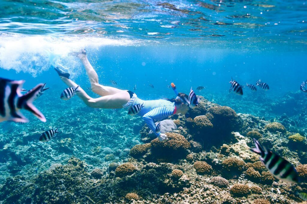 Woman with mask snorkeling